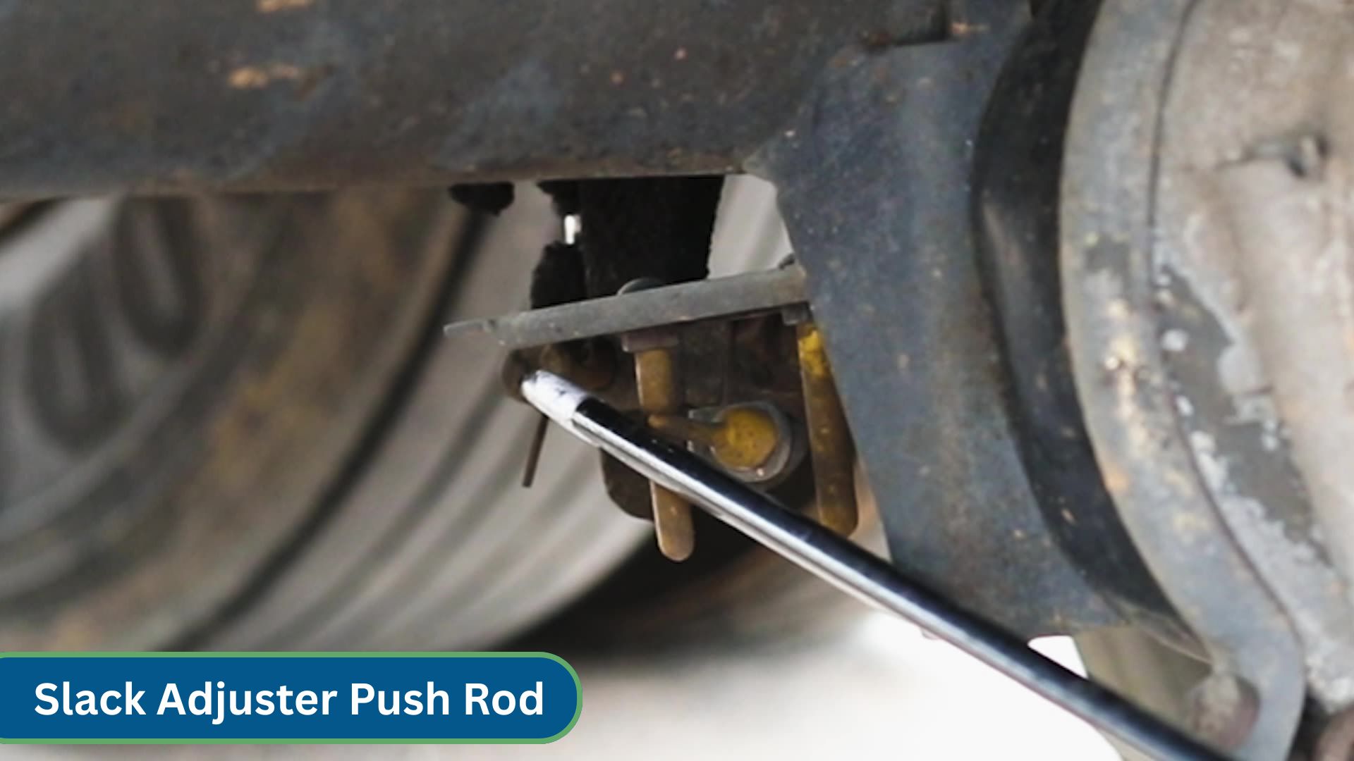 close up view of slack adjuster push rod