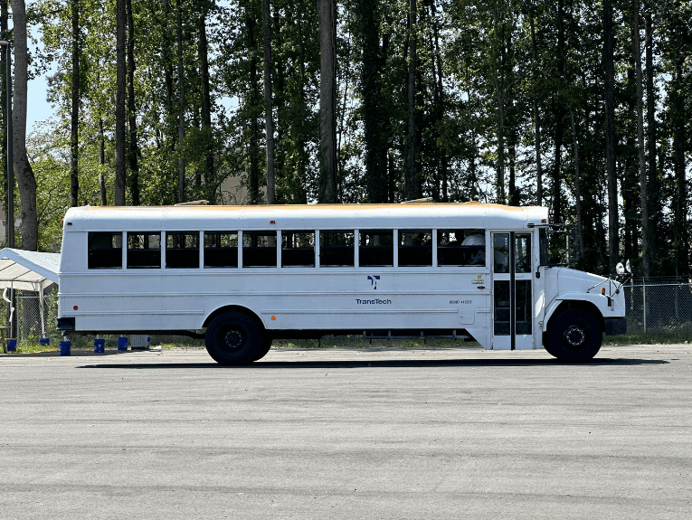 White school bus in the training yard