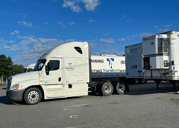 TransTech semi truck with a trailer parked in training yard