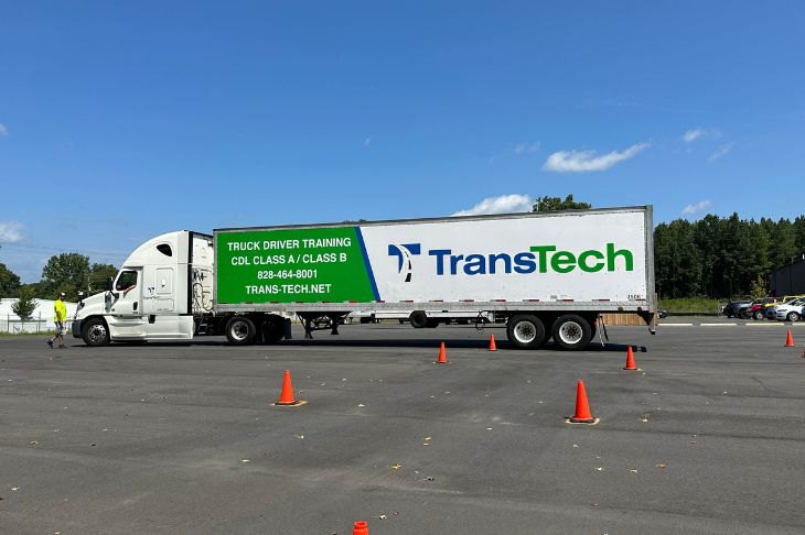 TransTech semi truck parked in training lot. Side view.