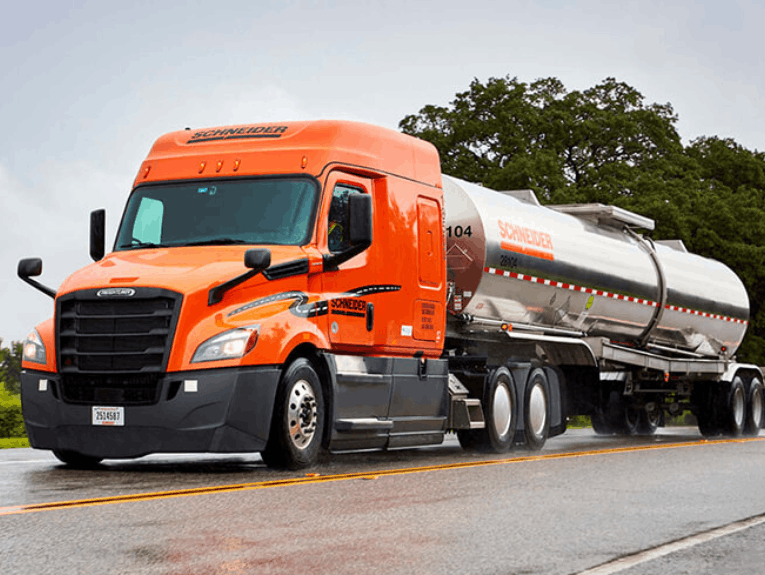 Schneider tanker truck parked in asphalt lot