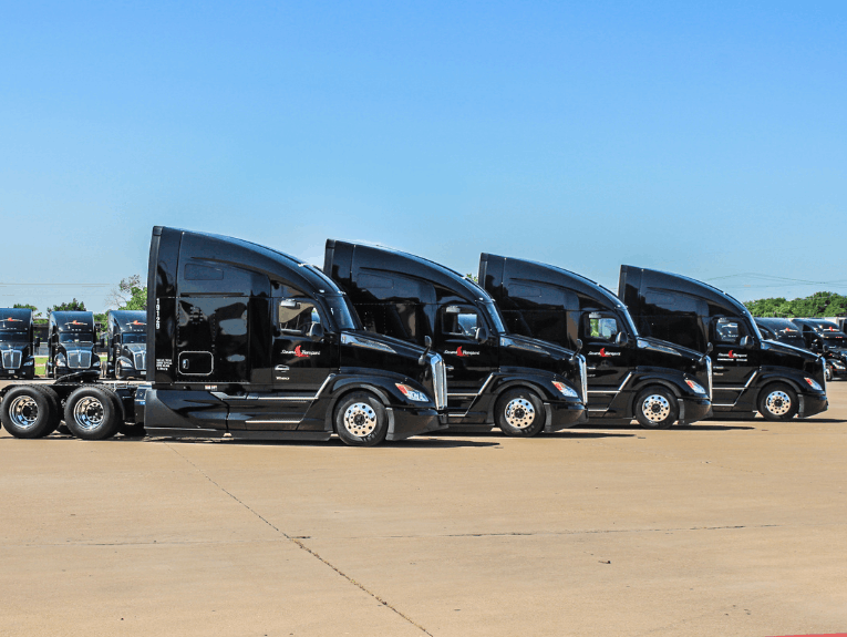 Four Stevens Transport cabs parked in a line