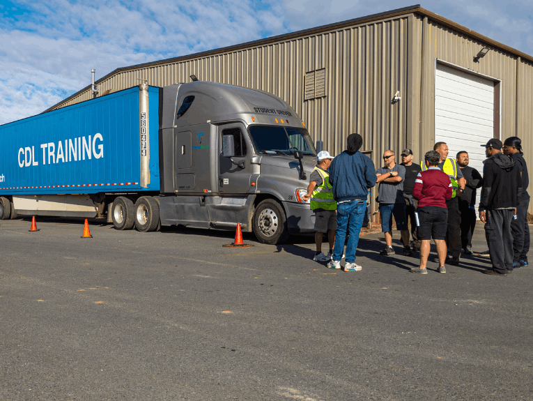 TransTech truck parked in training lot with students standing around