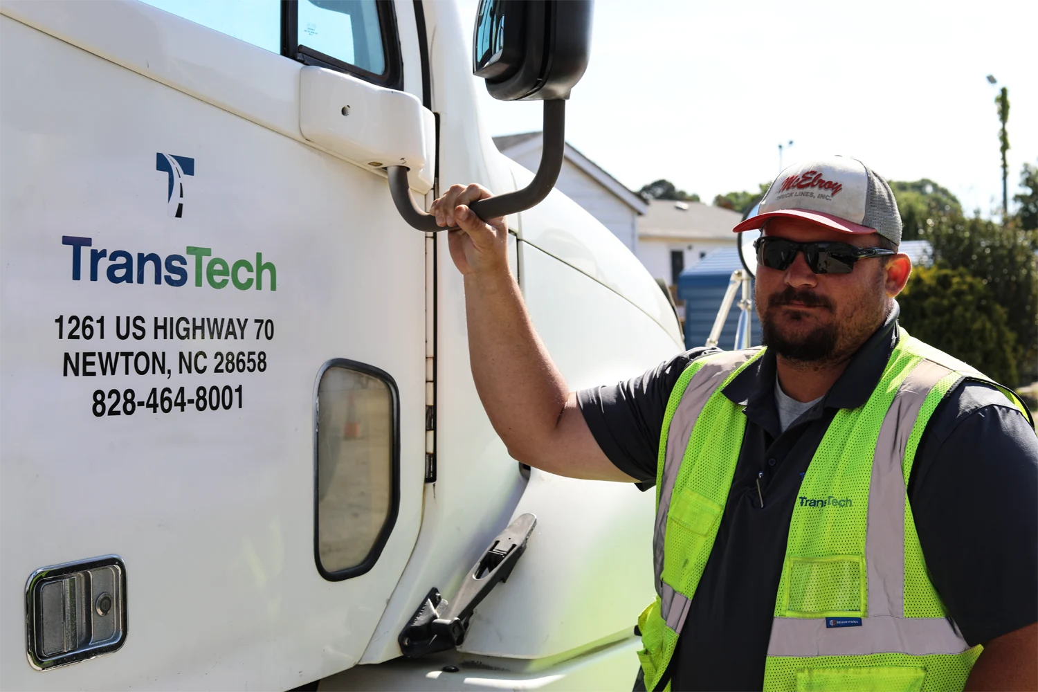 TransTech instructor holding the mirror of semi truck